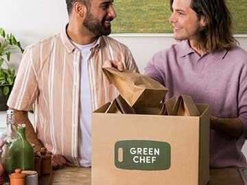 Couple opening box of Green Chef meals