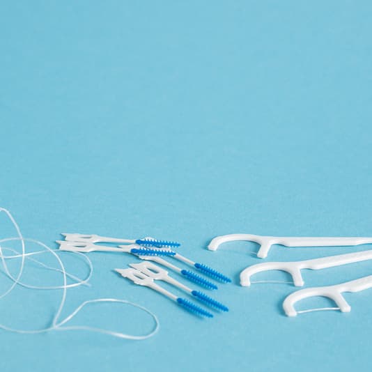 Interdental brushes and floss