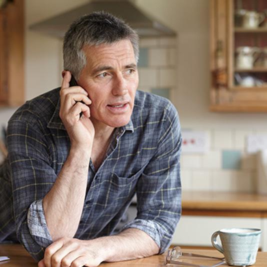 Man talking on the phone at home