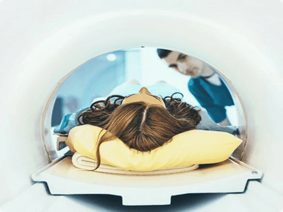 Woman lying down in MRI machine